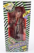 A Kenner Beetlejuice talking figure (dated 1989). Large scale doll with pull-string action. Boxed