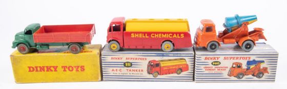 3x Dinky Toys/Supertoys. A Comet Wagon with hinged tailboard (418) in green and red. Lorry Mounted