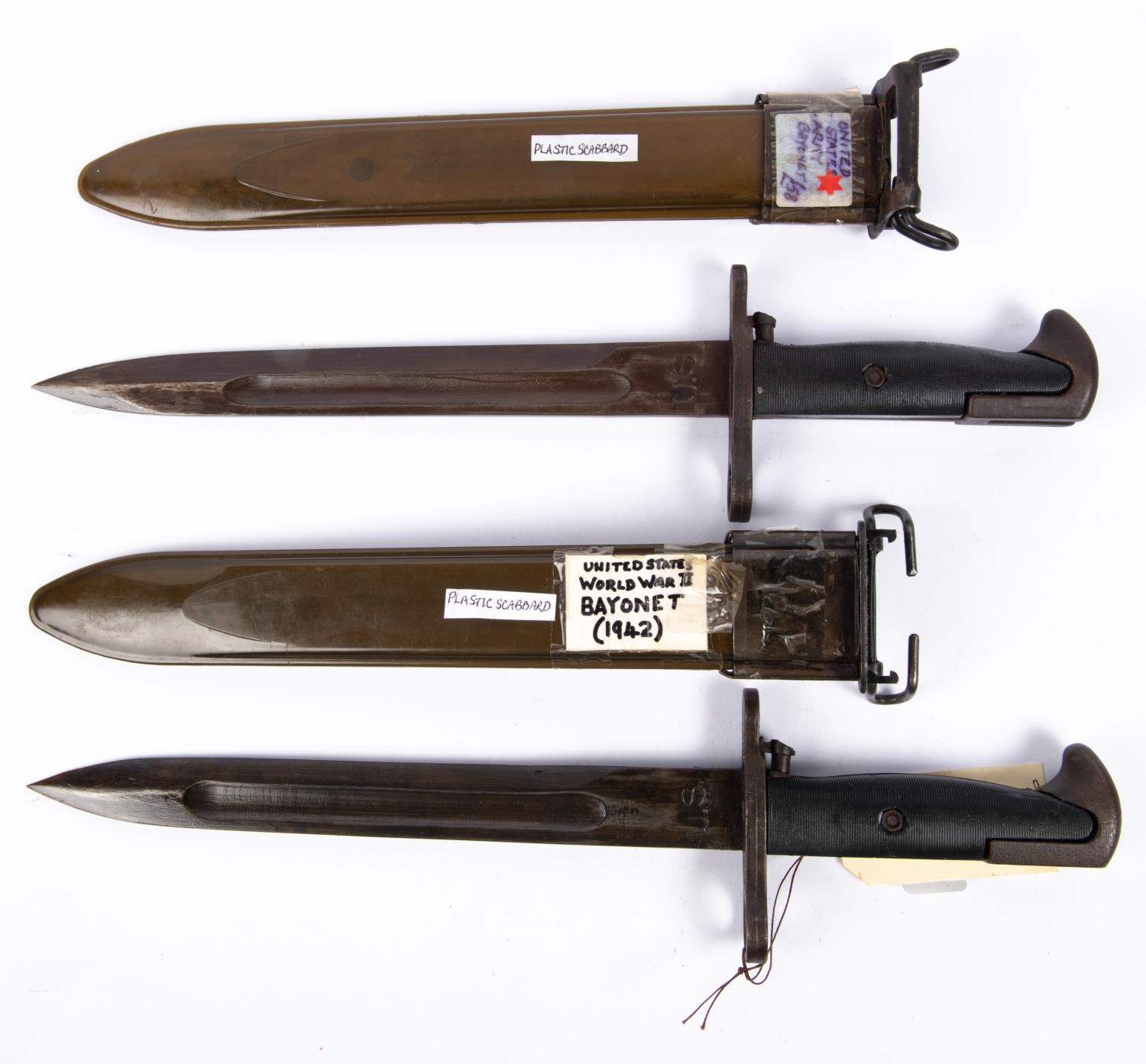 2 MI1943 knife bayonets, dated 1942 in plastic scabbards. VGC £80-100