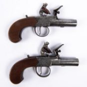 A pair of 42 bore flintlock boxlock pocket pistols by Lowdell of Lewes, c 1825, 6¼" overall, turn