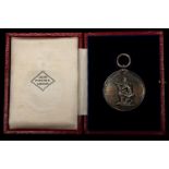 A Victorian shooting medal in silver, obverse oak and laurel spray enclosing engraved inscription "