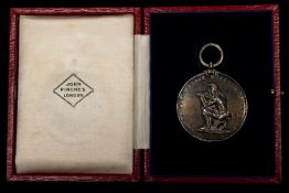 A Victorian shooting medal in silver, obverse oak and laurel spray enclosing engraved inscription "