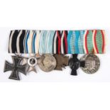 A group of six WW1 German medals: 1914 Iron Cross 2nd Class, Order of Merit with swords, Bavarian