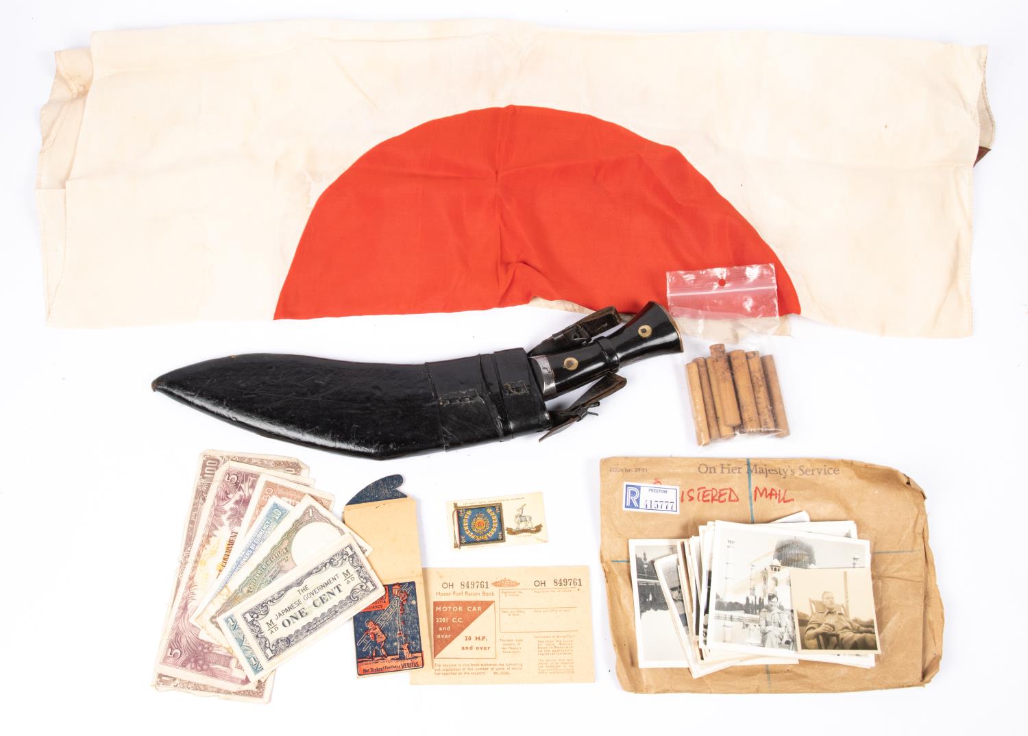 A Japanese silk flag, 28" x 35"; 10 Japanese bamboo ID sticks; a Kukri with 10" blade and horn