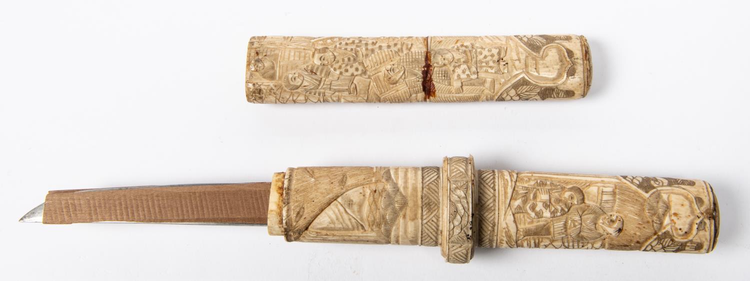 A Japanese carved bone dagger tanto, straight blade 8½” with 4” back edge, the hilt and sheath of