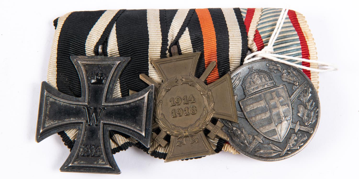 A WWI German medal trio: 1914 Iron Cross 2nd class, 1914-1918 Honour Cross with swords, and