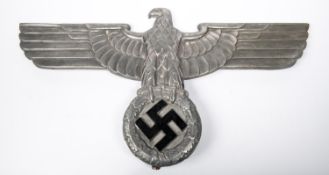 A good Third Reich metal eagle and swastika, removed from a building or vehicle, 26" wingspan. GC £