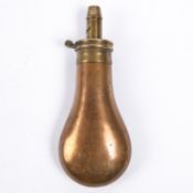 A plain copper powder flask 6½", the patent top stamped "Improved Patent" and"James Bartram & Co,