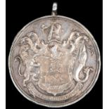 A small silver medal "To the South Devon Militia in Testimony of Merit 1799", obverse trophy of arms