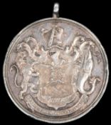 A small silver medal "To the South Devon Militia in Testimony of Merit 1799", obverse trophy of arms