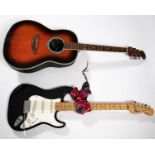 2x electric guitars and a Squier amp. An Ovation Celebrity Guitar, Model no. CS167 by Kaman Music