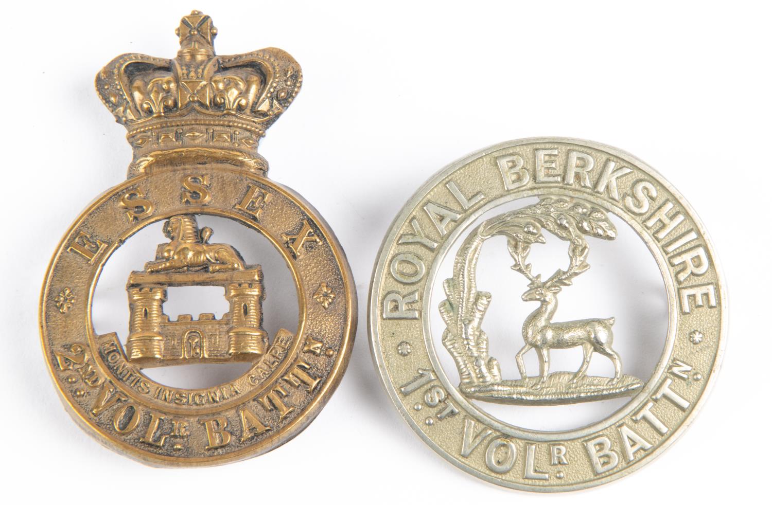 A Victorian brass glengarry badge of the 2nd Vol Battn the Essex Regiment, GC; and a white metal