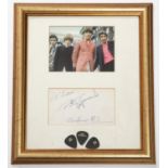 A framed signature of Pete Townshend from The Who. Signed on paper; 'To Lorrie Pete Townshend 24th