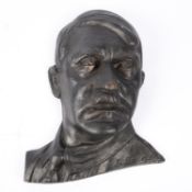 A Third Reich cast metal bust of Hitler, front face in relief, 13" x 11", makers mark on reverse "J.