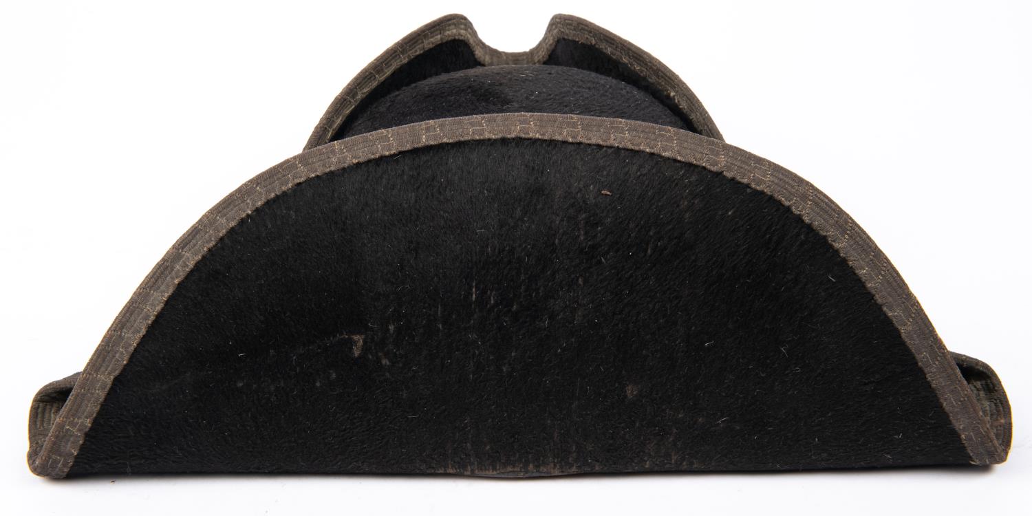 A 19th century tricorn hat, with bullion lace edging to the brim (dull), leather sweat band, and - Image 2 of 4