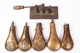 An embossed copper powder flask "Bush", and another, GO and basically GC (worn, minor dents);