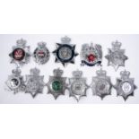 11 different ERII police chrome finish helmet plates, including 3 enamelled and 3 plastic "