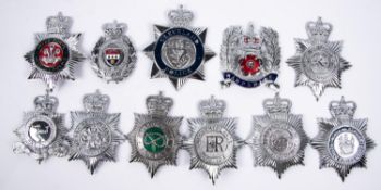11 different ERII police chrome finish helmet plates, including 3 enamelled and 3 plastic "