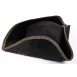 A 19th century tricorn hat, with bullion lace edging to the brim (dull), leather sweat band, and