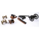 Five model cannon: 15th century mortar on 2 wheeled carriage; "Mary Rose" type cannon on solid base;