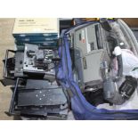 Assorted video camera spares including an Ikegami body, two view finders and six cased sets of