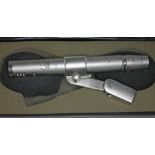 An AKG D224E microphone, boxed with stand mount. Condition - appears in working order, general