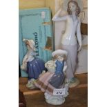 Three Lladro figures.