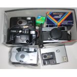 A box of cameras including an Olympus Trip 35, a Cannon Sure-Shot AF-7, a Polaroid 252 BV, a Kodak