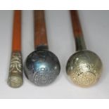 A hallmarked silver mounted Lancashire Fusiliers swagger stick, a nickel mounted Lancashire