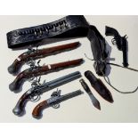 A reproduction belt holster & revolver, 4 reproduction pistols and a throwing knife.