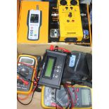 A quantity of testing equipment including a particle counter, a Sound Lab cable tester, Mastech