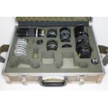 A flight case containing four Nikon Nikkor; 300mm 1:45, 85mm 1:2, 35mm 1:2.8 & ED 180mm 1:2.8,