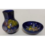 A Moorcroft pottery bowl, 9.5cm dimeter and a Moorcroft pottery vase, height 10cm.