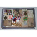 A group of WWII medals comprising a group of five awarded to C.F. Evans, future husband and wife