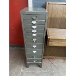 A ten drawer metal filing cabinet.