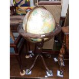 An illuminated globe on stand.