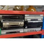 A collection of electronics to include Panasonic NV-FJ630 Hi-Fi Nicam, a Diga VHS / DVD recorder /