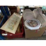 A box of collectors plates and a box of misc picture frames.