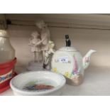A vintage Dick Whittington teapot, a Wedgwood baby dish & a plaster/chalkware children figure.