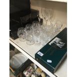 A quantity of drinking glasses, boxed and unboxed