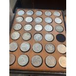 A box of wooden coin trays to include various modern crowns