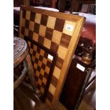 Two chess boards and a folding tray table.