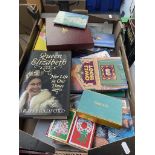 A box of books and playing cards including Tiffany & Co and a box containing a Sony audio system