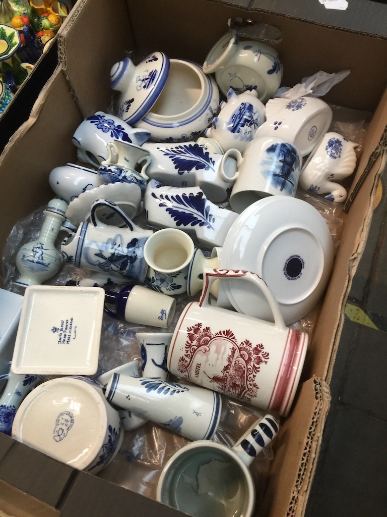 A box of mixed blue and white ware