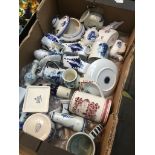 A box of mixed blue and white ware