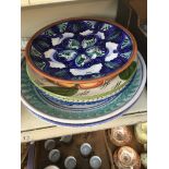 A collection of large ceramic and terracotta plates (6)