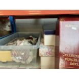 A box of various dolls to include bisque and 3 boxed dolls.