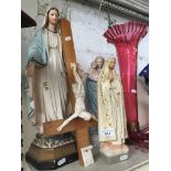 3 religious statues and a crucifix