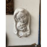 A plaster sculpture of Mary and child