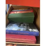 A box of Folio Society books.